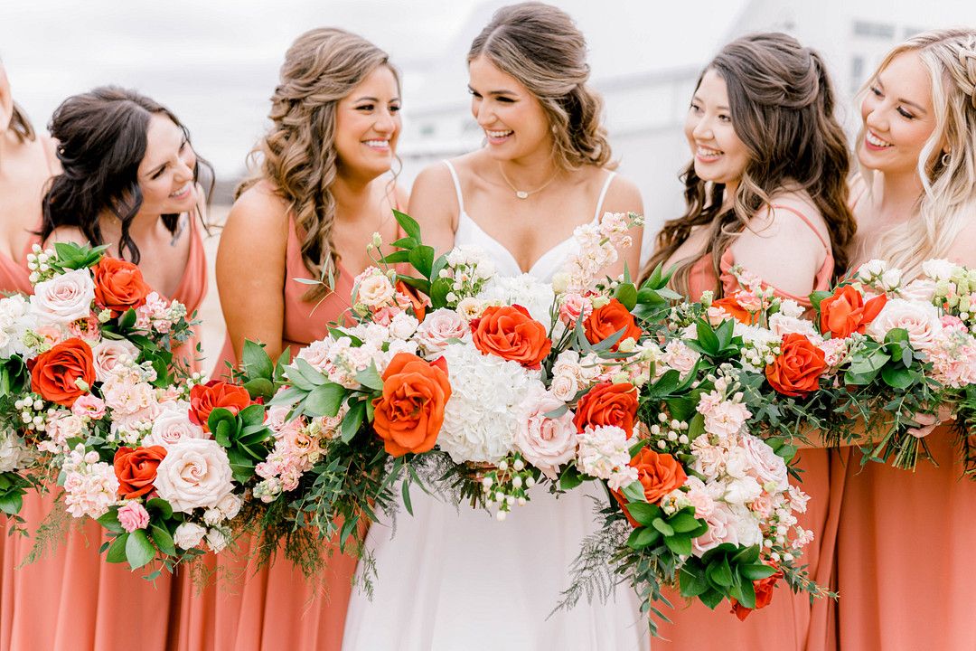 bride and bridesmaid photo with flower bouquets 