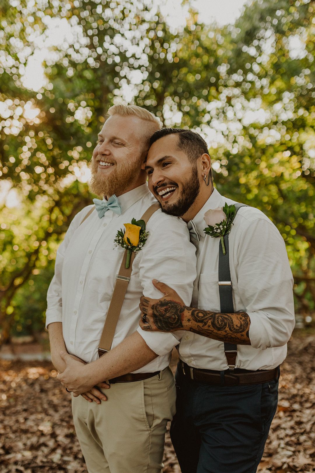 grooms smiling on their wedding day