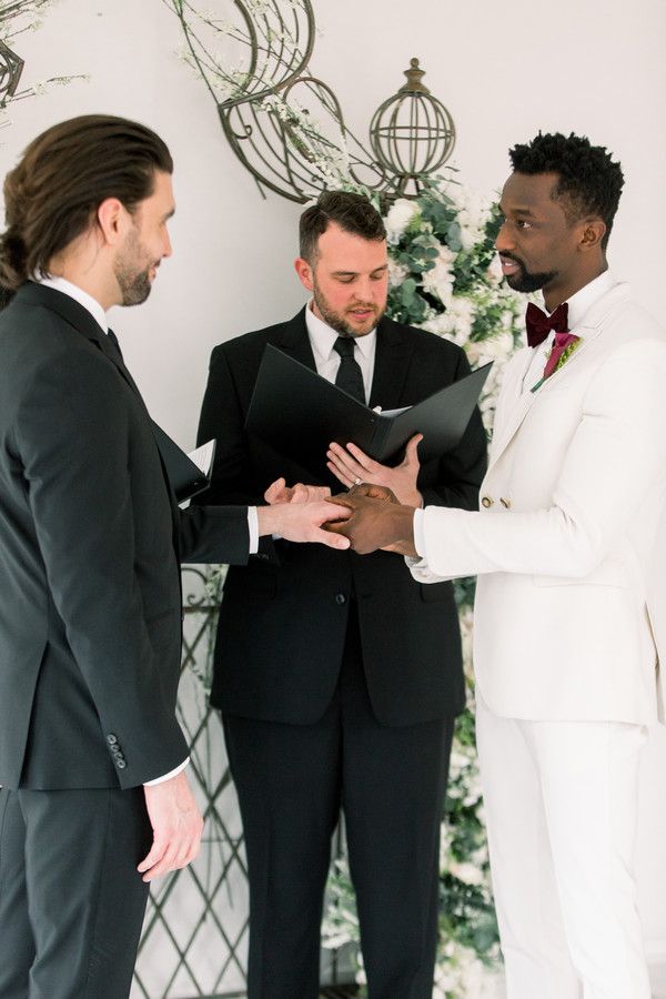 grooms exchanging vows at at-home wedding