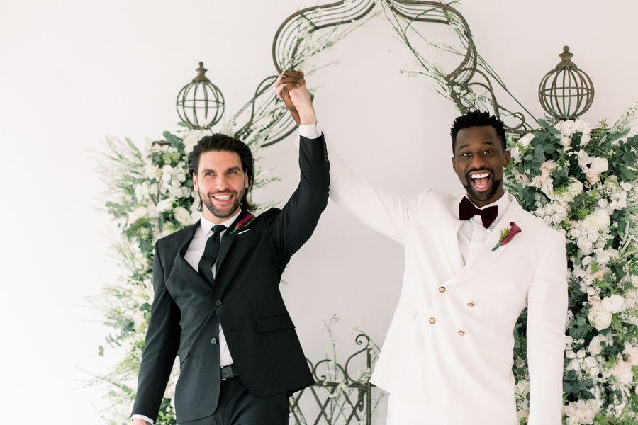 grooms smiling and celebrating