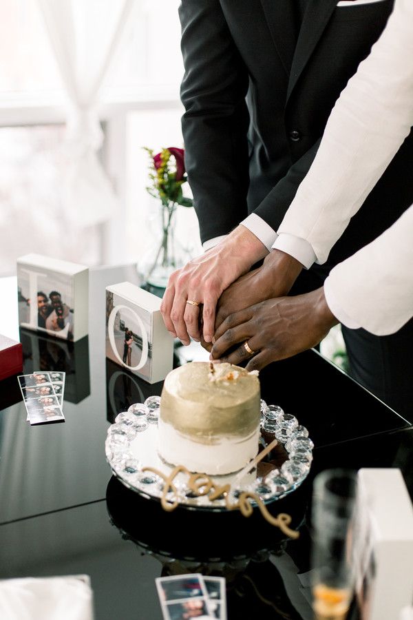 grooms cutting cake at at-home wedding