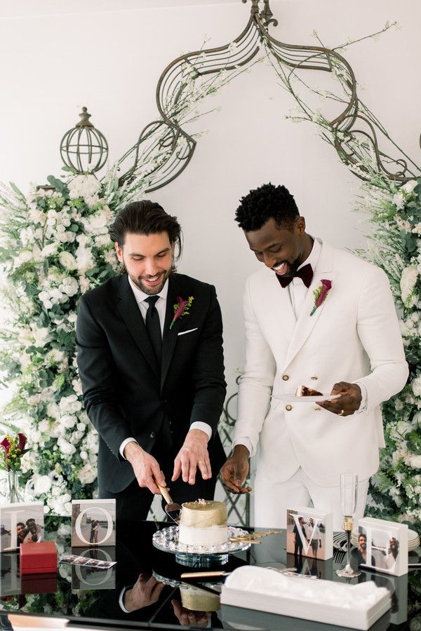 grooms cutting cake at at-home wedding