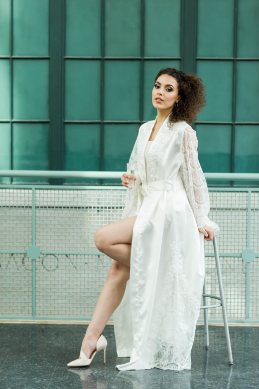 women wearing a long lace robe and heels