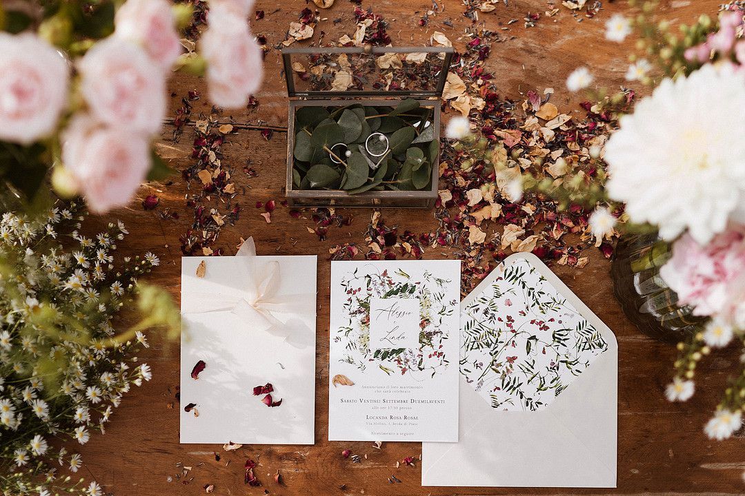 wedding invitations coved in dried flower petals 