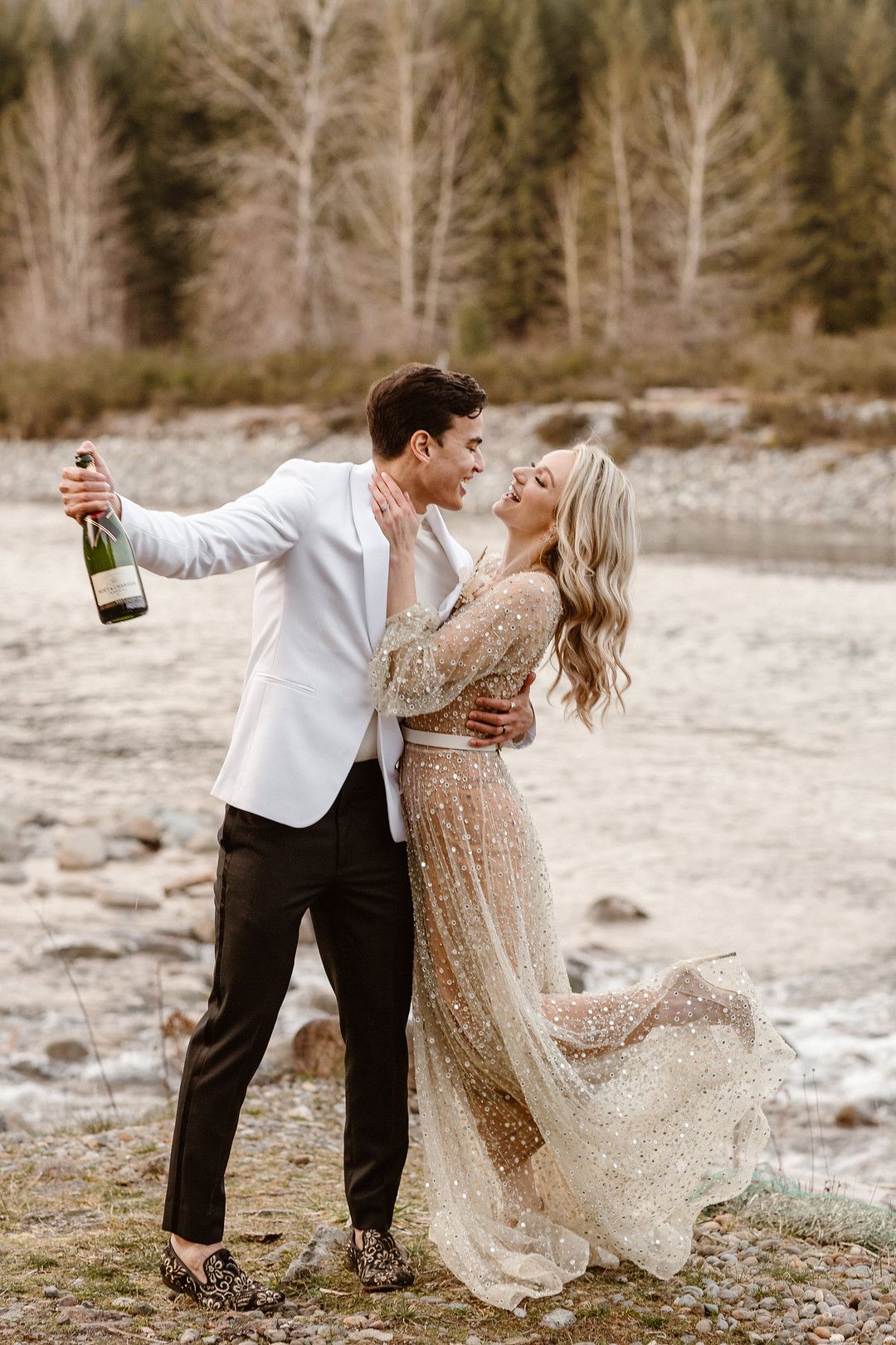 bride and groom popping champagne
