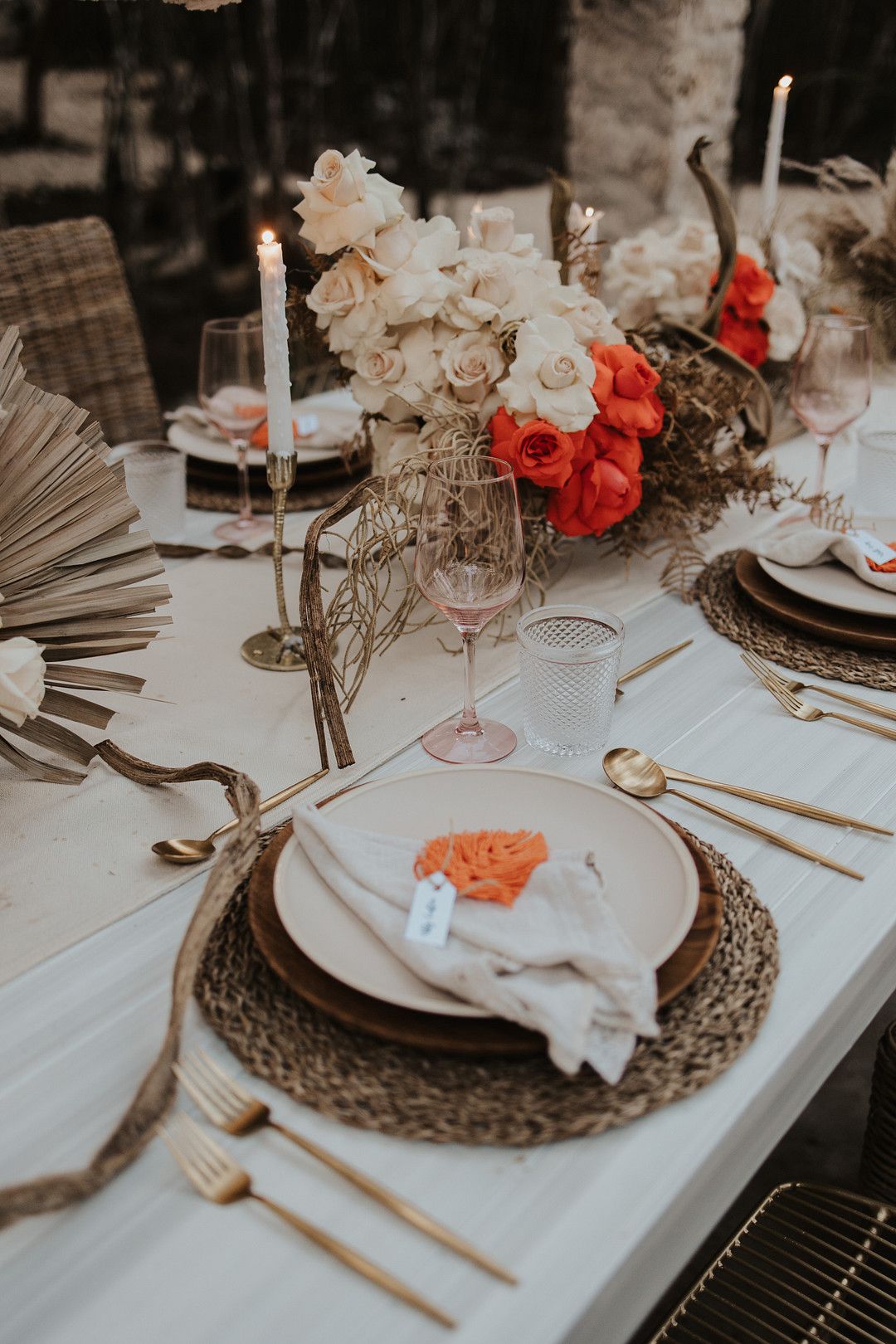 bohemian wedding table decor with pops of orange