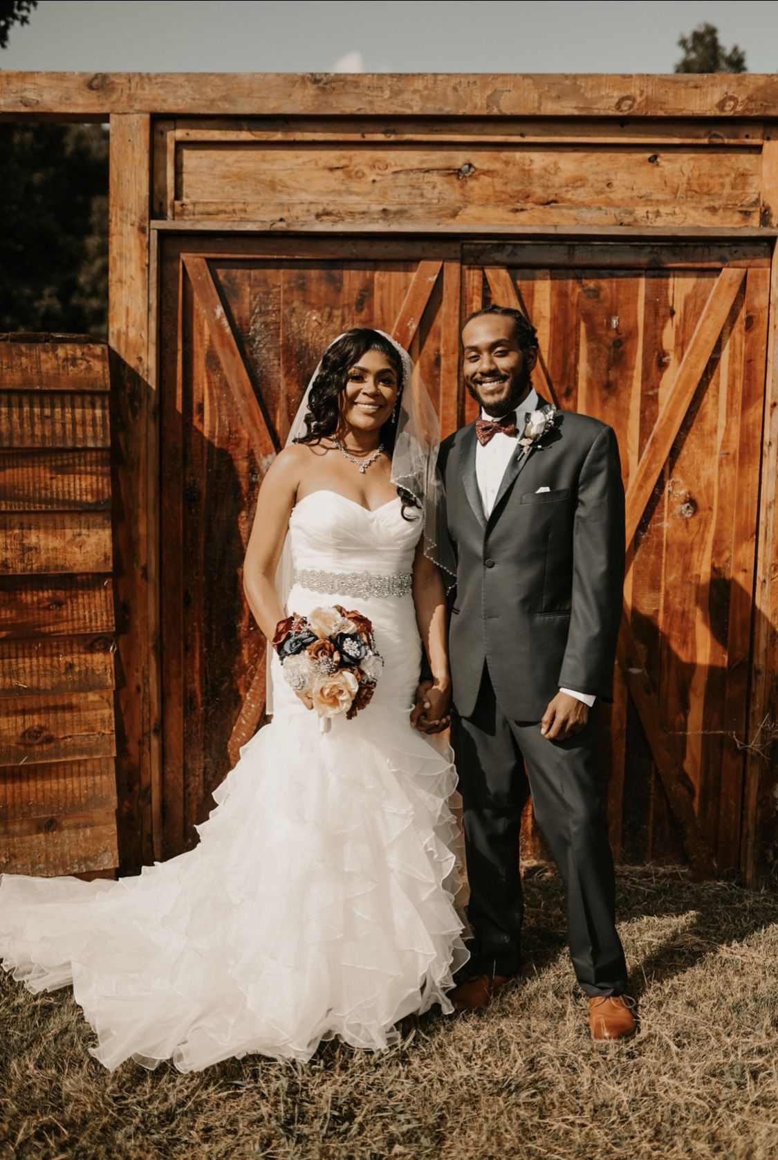 bride and groom smiling at simple and elegant outdoor fall wedding