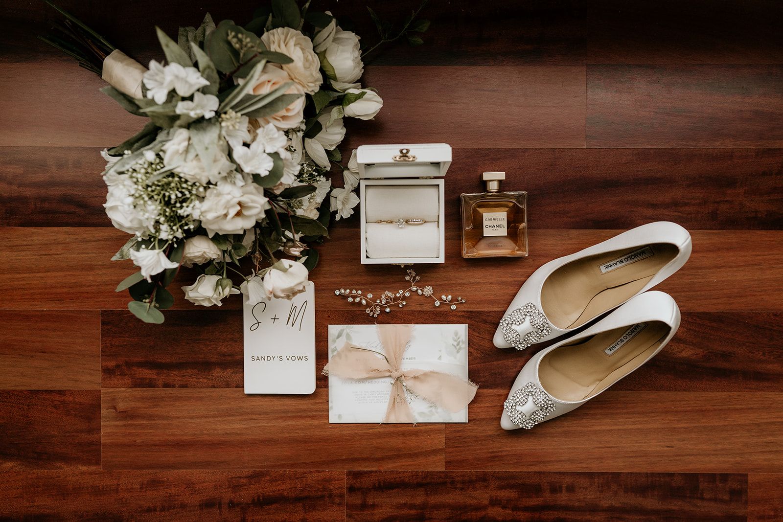 bride's shoes, flowers, and perfume