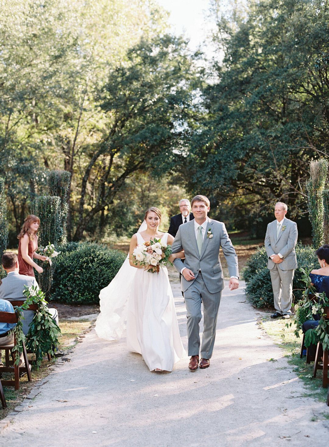 bride and groom walking down aisle at fall wedding in south carolina