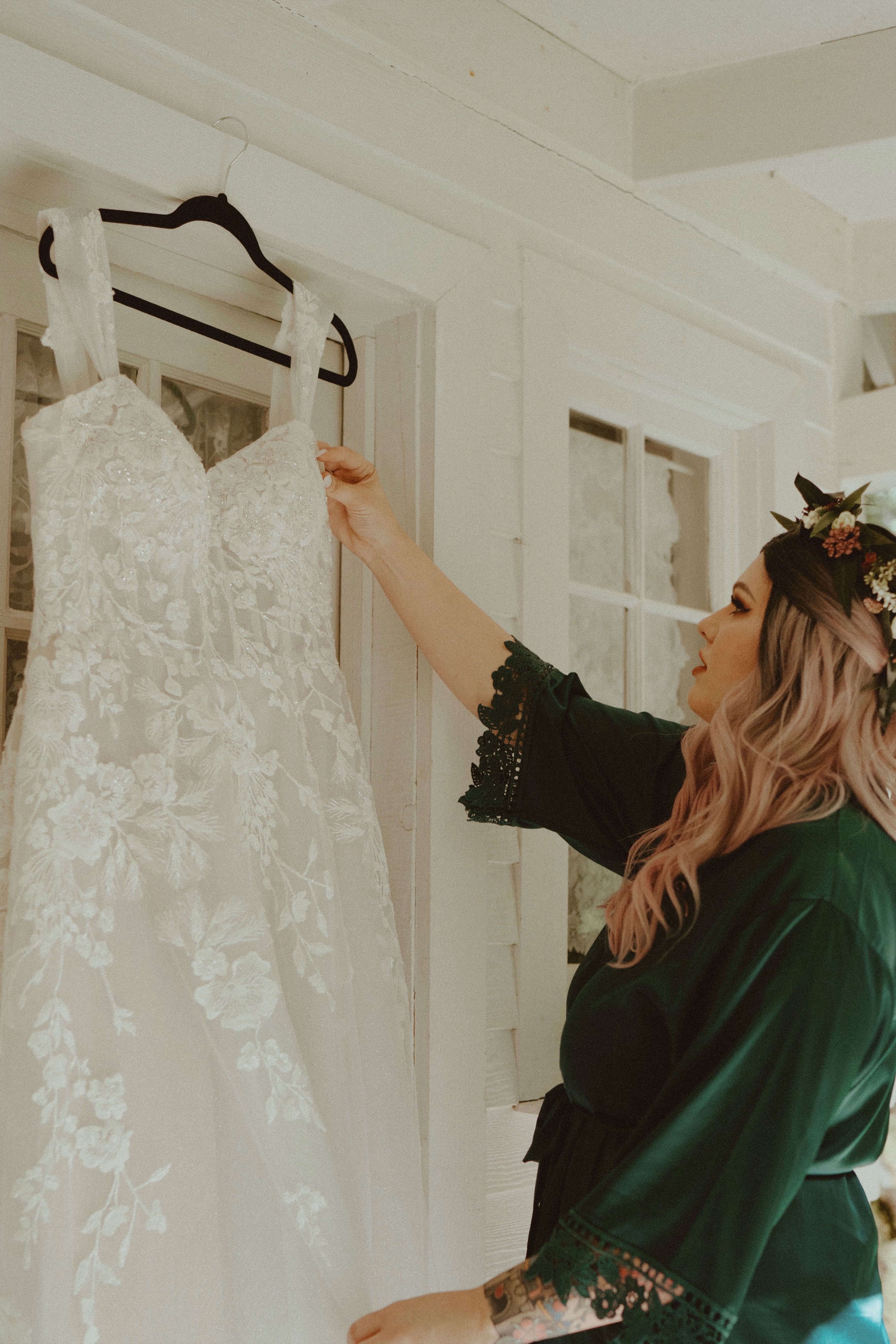 bride looking at wedding dress