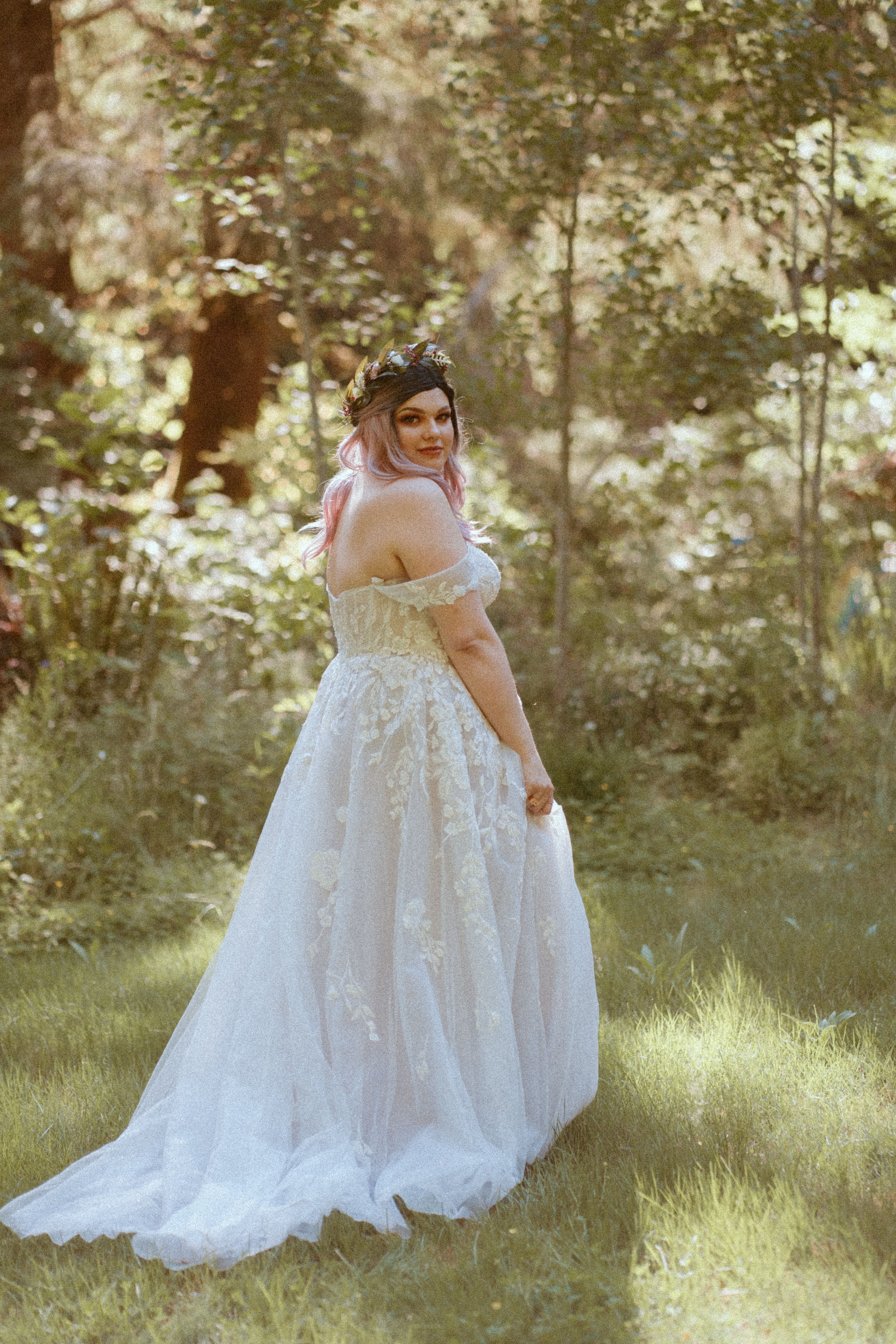 bride in woods in wedding dress