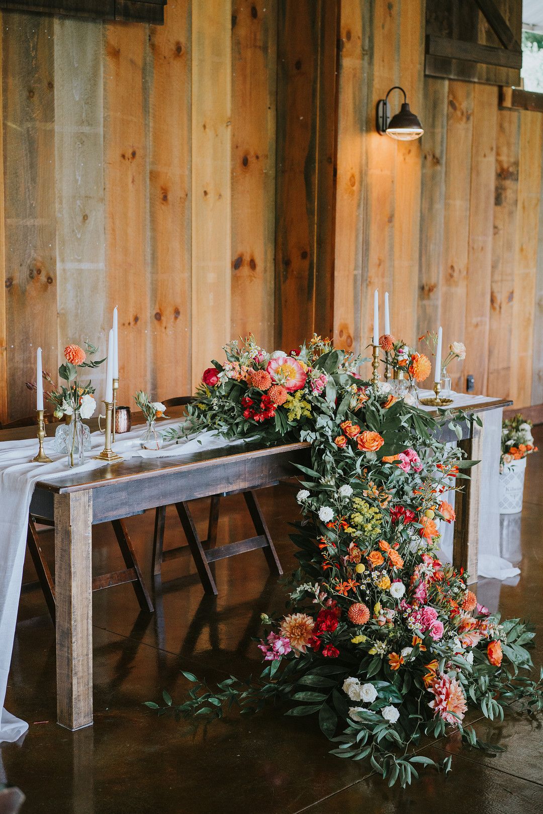 wedding table with overflowing flowers