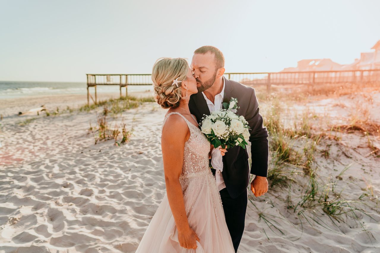 bride and groom at romantic beach wedding in Alabama