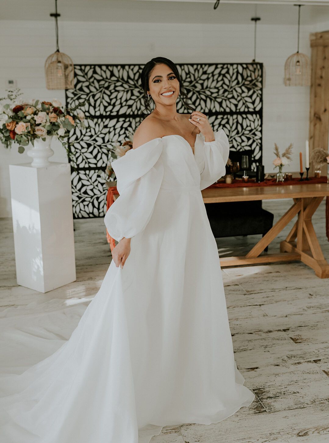 bride wearing flowy off-the-shoulder dress