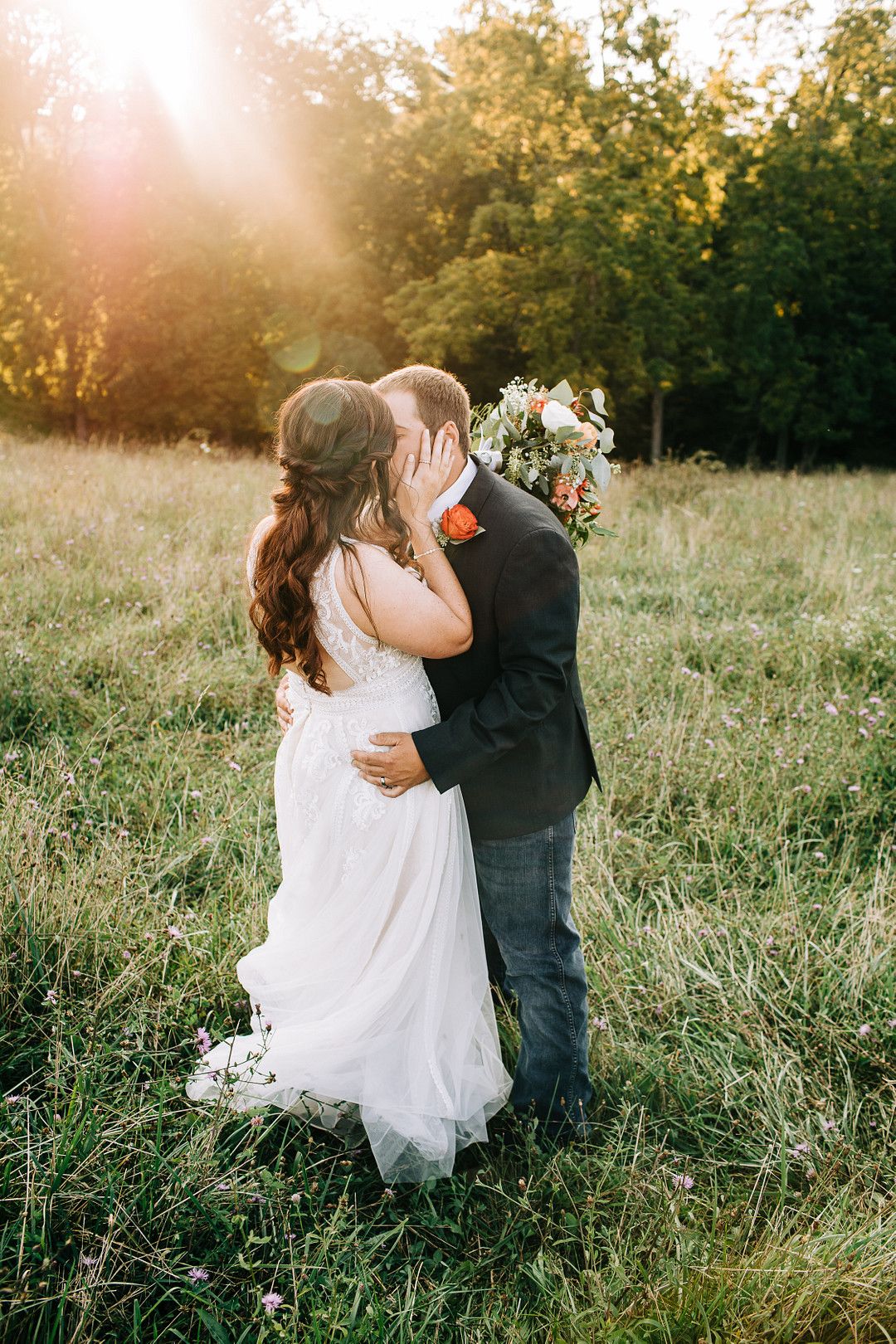 couple in field at golden hour